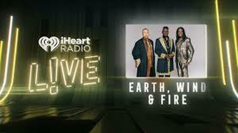 Three of the original members of the R&B and disco band Earth Wind and Fire stare directly at the camera.