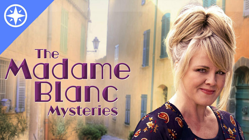Sally Lindsay, as Jean White, stands on a French village road. The show title "The Madame Blanc Mysteries" appears to her right.