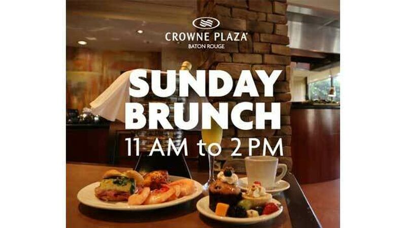Two brunch entrees on a table with a cup of coffee